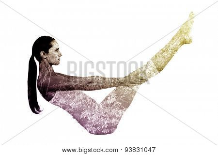 Toned woman doing the boat pose in fitness studio against beautiful pink leaved trees