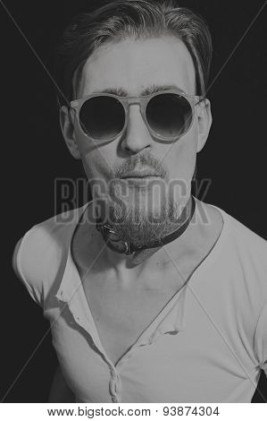 Portrait Of Young Man In Round Sunglasses