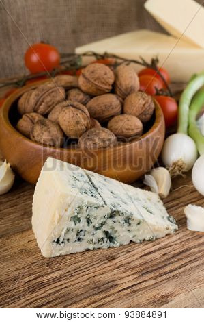 Big Portion Of Niva Cheese In Front Of Various Vegetable