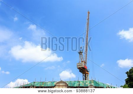 Crain Construction Building In Blue Sky.