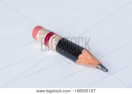 Black Pencil With Pink Eraser On A Paper