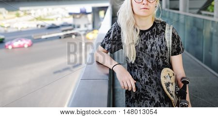 Young Woman Holding Skateboard Outdoors Concept