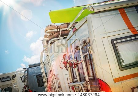 Motorhomes RV Park. Class B Motorcoaches Parking Closeup.