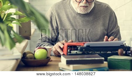 Senior Adult Using Typewriter Typing Concept