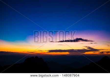 Mountain Silhoette Of Sub Alpine At Sunrise Glowing Sky