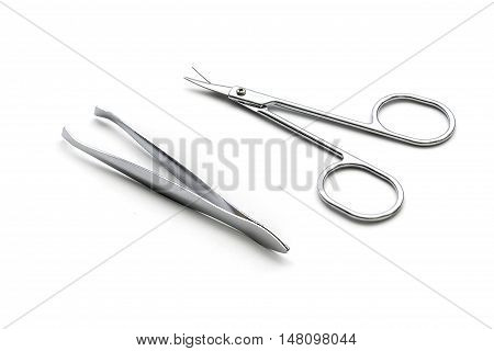 scisor and tweezers isolated on white background