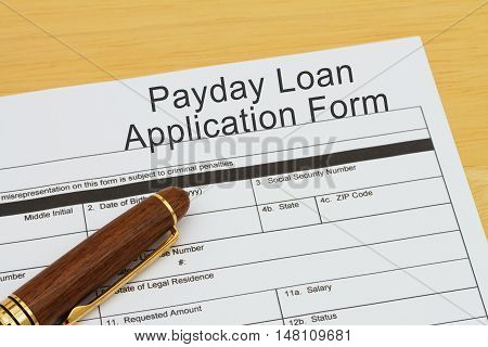 Applying for a Payday Loan Payday loan application form with a pen on a desk