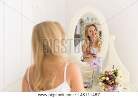 Beautiful Blonde Woman Looking In Mirror Brush Hair, Young Girl Morning Happy Smiling Back Rear View