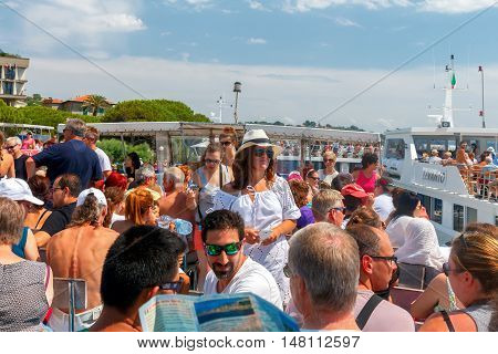 Portovenere. Italy - July 24, 2016: Many tourists on the decks of pleasure boats in Portovenere. Boat trips are very popular among tourists on the coast. Liguria. Cinque Terre. Italy
