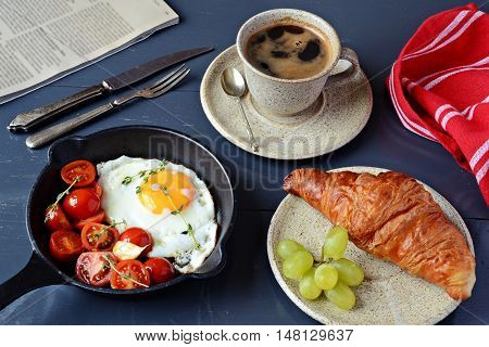 Fried egg and coffee breakfast, top view