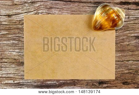 blank recycle paper with paperweight on ancient wooden table background