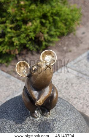 LITHUANIA, KLAIPEDA - MAY 25, 2014: Sculpture Wonderful little mouse is oldtown Klaipeda. Lithuania. One of the most famous sculptures in the city.