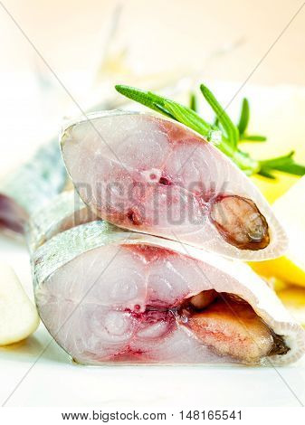 Fresh Cutting Mackeral In Olive Oil With Garlic And Rosemary On The White Plate . Selective Focus Sh