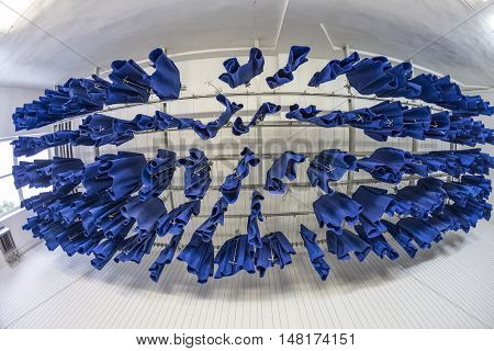 Workers Clothes Hanging At The Ceiling In A Mining Plant