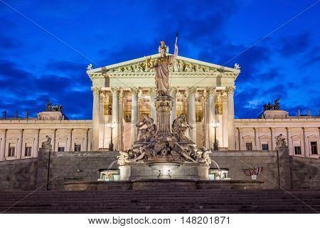 Austrian Parliament Building At Night landmark of Vienna with Pallas Athena Fountain in front