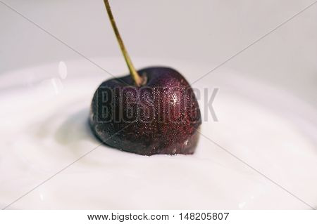 macro pictures of cherry in natural yoghurt