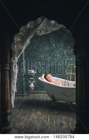 Female in the old bath. retro photo