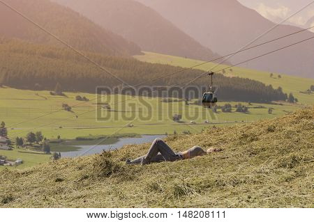 Female  in a sports suit on funicular background
