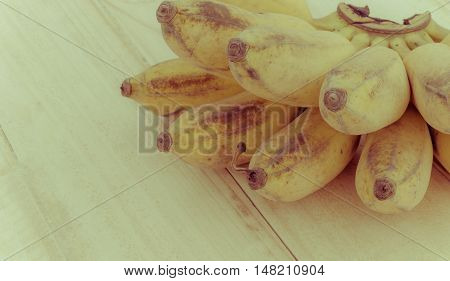 Pisang Awak banana Kluai Nam Wa Cultivate banana on wooden background copyspace vintage retro style.