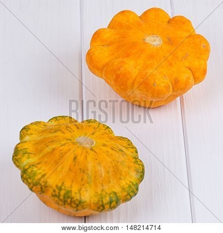 Group of autumn squash over a white background