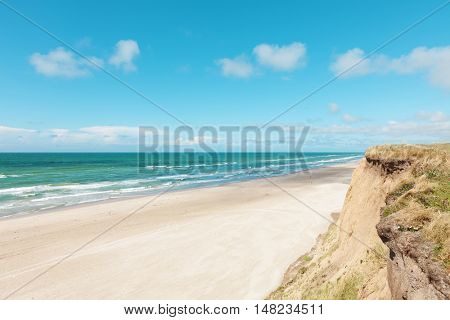 Paragliding on the deserted beach, unspoiled nature