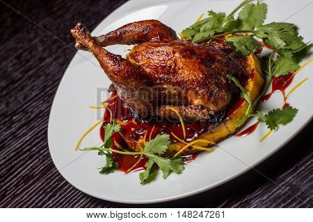 baked chicken on a bed of pumpkins