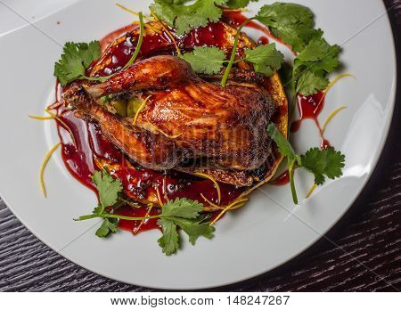 baked chicken on a bed of pumpkins