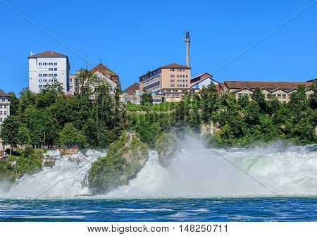 The Rhine Falls waterfall on the Rhine river in Switzerland in summertime.