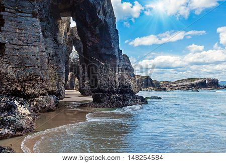 Natural Arches On Beach And Sunshine
