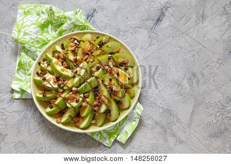 Loaded apple nachos with caramel, chocolate chips, granola and almonds