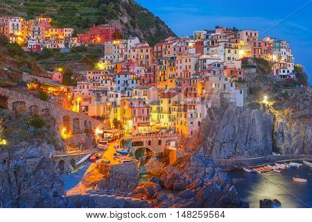 Aerial night view of Manarola fishing village, seascape in Five lands, Cinque Terre National Park, Liguria, Italy.