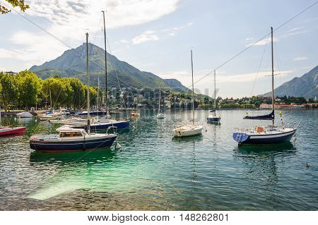 LECCO, ITALY - AUGUST 17, 2016: View of Como lake from Lecco side with boats at foreground