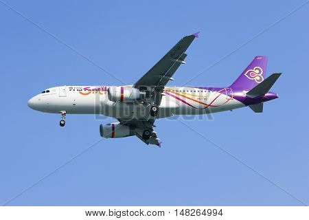 CHIANGMAI, THAILAND -JANUARY 7 2013: HS-TXC Airbus A320-200 of Thaismile airway. Landing to Chiangmai airport from Bangkok Suvarnabhumi.
