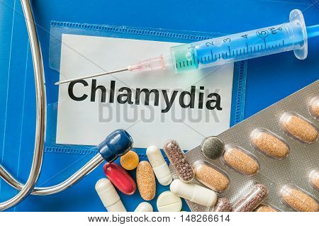 Chlamydia Desease Concept. A Lot Of Pills And Syringe Around.
