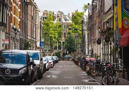 Amsterdam Netherlands - July 03 2016: The traditional Dutch houses on Kerkstraat street evening time