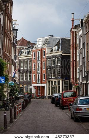Amsterdam Netherlands - July 03 2016: The traditional Dutch houses on Kerkstraat street evening time