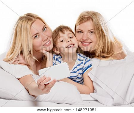 Cheerful relations girlfriends taking picture of themselves on white background