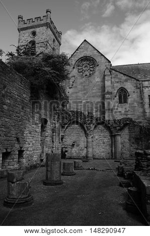A view of the ruins of Culross abbey and the church behind
