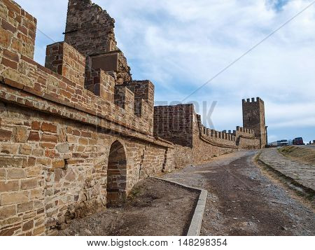 Genoese fortress in Sudak - a monument of history and ancient architecture , willingly visited by numerous tourists