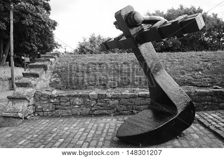 A large shipping anchor on display in Culross