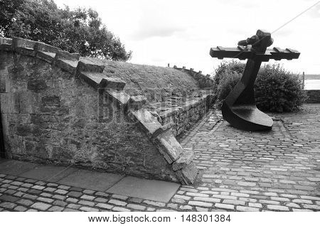 A large shipping anchor on display in Culross