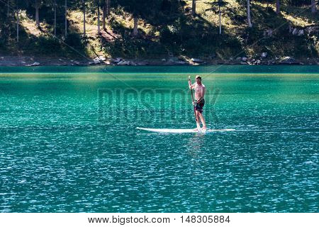 Man On A Paddleboard At Caumasee, Switzerland
