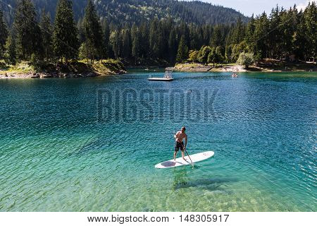 Man On A Paddleboard At Caumasee, Switzerland
