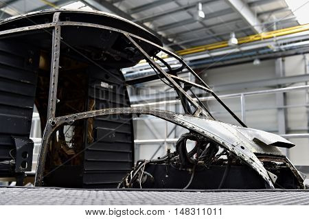 Detail with helicopter fuselage on the repair line in a factory