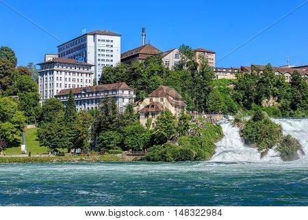 Neuhausen am Rheinfall, Switzerland - 22 June, 2016: buildings at the Rhine Falls. Neuhausen am Rheinfall is a municipality in the Swiss canton of Schaffhausen, known for the Rhine Falls - the largest plain waterfall in Europe.