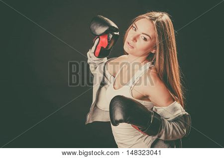 Exercising prepare for fight. Sportsmanship and strong body. Energetic woman wear sportswear with exposed shoulders boxing with opponent. Sport and fitness healthy lifestyle.