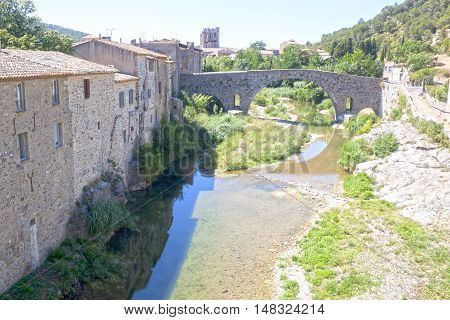 View Of Lagrasse, Houses, Bridge And The Abbey, France