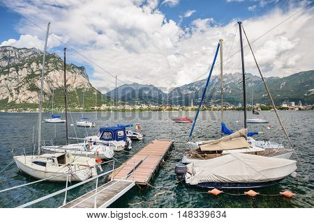LECCO, ITALY - AUGUST 17, 2016: View of Lecco with boats at foreground