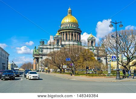 SAINT PETERSBURG RUSSIA - APRIL 25 2015: The golden domed St Isaac's Cathedral is one of the largest in the world on April 25 in Saint Petersburg.