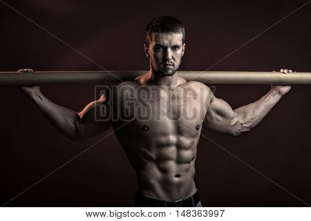 Muscular Man With Crossbar